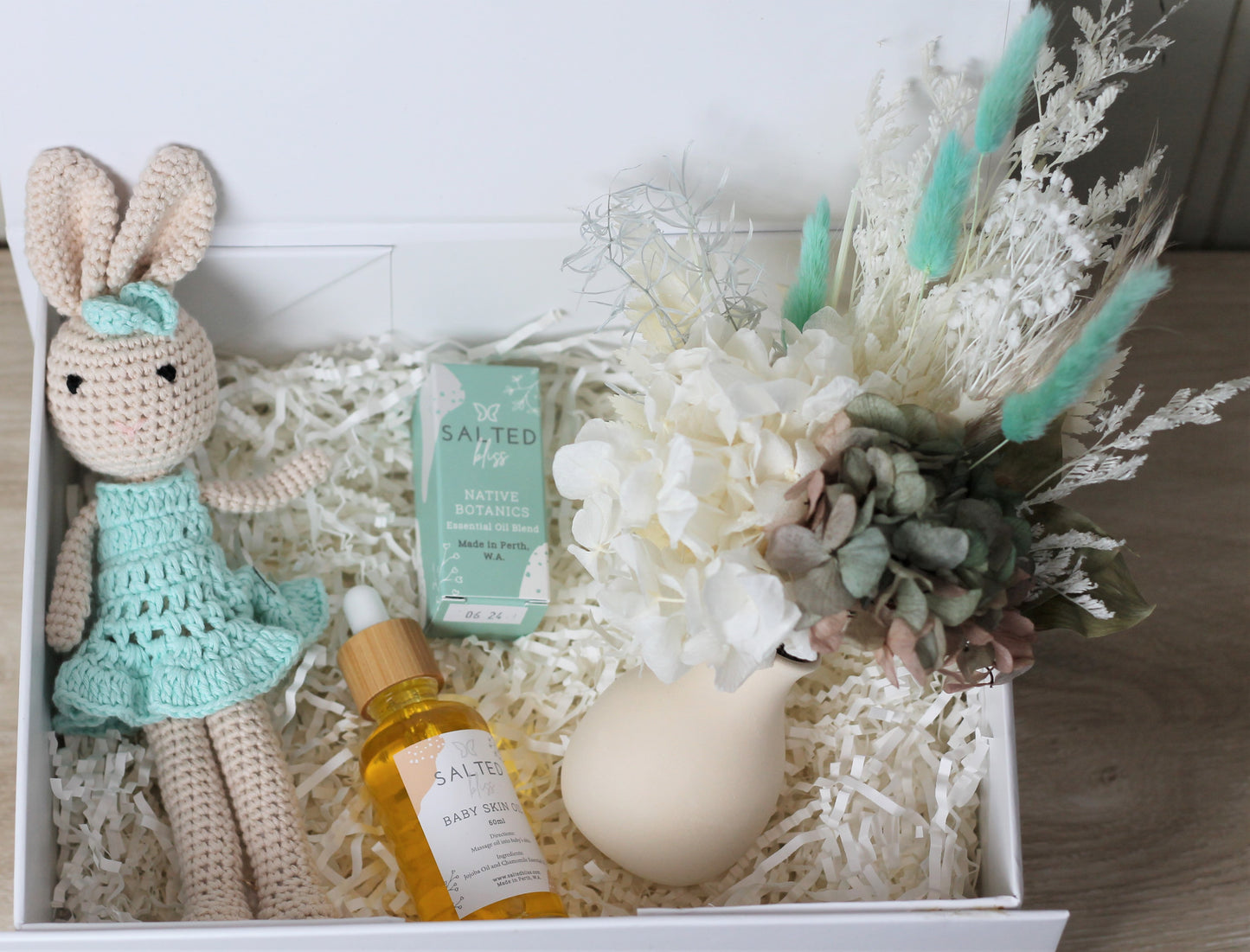 Gift box with crochet  toy rabbit,  dried flower posy and essential oil baby lotion. Baby  gift box delivery options avaliable 